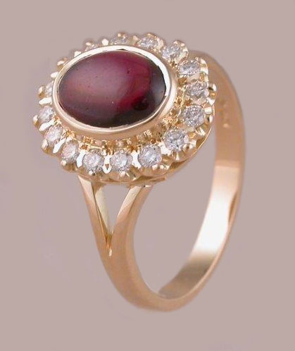 oval ruby cabuchon diamond cluster ring